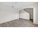 Open living room with wood-look floors and neutral paint at 3125 S Northview Rd, Plant City, FL 33566