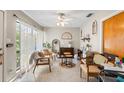 Bright living room with terrazzo flooring, decorative accents, natural light and ceiling fan at 3622 W Mullen Ave, Tampa, FL 33609