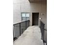 Unit front door with exterior ramp and alarm system access for easy entry at 4207 Winding Moss Trl # 201, Tampa, FL 33613