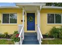 Welcoming front door featuring a stylish wreath and fresh landscaping at 508 38Th N Ave, St Petersburg, FL 33704