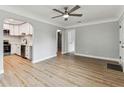 Spacious living room with modern ceiling fan and an open-concept design at 508 38Th N Ave, St Petersburg, FL 33704