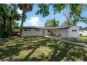 Well-maintained home with a spacious lawn, updated exterior and a cozy outdoor deck at 6108 Oak Ridge Ave, New Port Richey, FL 34653