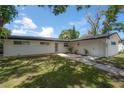 Charming home featuring fresh exterior paint and an inviting outdoor deck at 6108 Oak Ridge Ave, New Port Richey, FL 34653