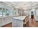 Elegant kitchen with marble countertops, a large island, pendant lighting, and hardwood floors at 6220 Bayshore Blvd, Tampa, FL 33611
