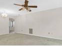 Spacious living room with ceiling fan and neutral carpet at 7000 Lafayette N, Pinellas Park, FL 33781