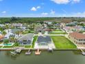 Waterfront home with boat dock and lush green surroundings in a beautiful neighborhood at 7401 Islander Ln, Hudson, FL 34667