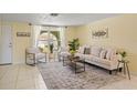 Bright living room with neutral tones, stylish decor, and ample natural light at 7401 Islander Ln, Hudson, FL 34667