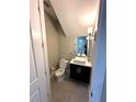Contemporary half bathroom with a vessel sink and sleek fixtures at 9005 W Flora St, Tampa, FL 33615