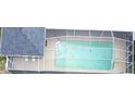 Aerial view of the screened-in pool area with pool furniture and ample space for recreation at 10287 Fordham St, Spring Hill, FL 34608