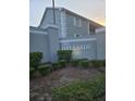 The Hillside entrance sign with manicured bushes, surrounded by lush greenery at 12133 Spartan Way # 203, Hudson, FL 34667