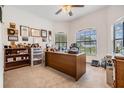 Bright office with large desk, plush carpet, and window bringing in lots of light at 12251 Duckett Ct, Spring Hill, FL 34610