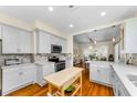 Modern kitchen with stainless steel appliances, custom cabinets, and an open layout great for entertaining at 1951 Edgewater Dr, Clearwater, FL 33755