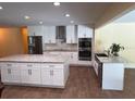Modern kitchen featuring stainless steel appliances, granite countertops, and a large center island at 2005 Capri Rd, Valrico, FL 33594
