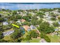 Aerial view of property highlighting its location near the water and featuring a backyard pool at 211 Arlington E Ave, Oldsmar, FL 34677