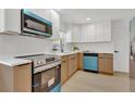 Well-appointed kitchen showcasing stainless steel appliances and stylish cabinetry at 2837 Woodcrest Dr, Sarasota, FL 34239