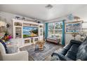 Cozy living room with a large window, built-in shelving, stylish decor, and comfortable seating at 3015 Florida Blvd, Bradenton, FL 34207