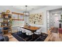 Elegant dining area features stylish lighting, a large dining table, and chic decor at 303 N Beverly Ave, Tampa, FL 33609