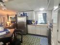 Eat-in kitchen with stainless steel appliances and wood-look countertops at 5248 Antigua Dr, Zephyrhills, FL 33541