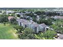 Scenic aerial view of condo complex with surrounding lush greenery and residences at 700 Starkey Rd # 311, Largo, FL 33771