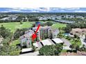 Beautiful aerial view of the condo complex, golf course, lake and the surrounding landscape at 700 Starkey Rd # 311, Largo, FL 33771