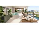 Private balcony featuring an in-ground jacuzzi, with gorgeous water views and lounge chairs at 111 S Ashley Dr # 3307, Tampa, FL 33602