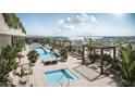 Beautiful rooftop pool and lounge area surrounded by lush tropical landscaping and city views at 111 S Ashley Dr # 3308, Tampa, FL 33602