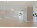 Spacious living room with tile floors, recessed lighting and great natural light at 11225 4Th E St, Treasure Island, FL 33706