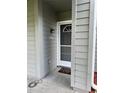 Close up view of front door with address number and white trim at 11941 Skylake Pl # 11941, Temple Terrace, FL 33617