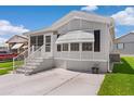 Charming single-Gathering home with a well-manicured lawn, complemented by a spacious driveway and inviting entrance steps at 3333 26Th E Ave # 1090, Bradenton, FL 34208