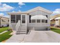 Charming single-Gathering home with a well-manicured lawn, complemented by a spacious driveway and inviting entrance steps at 3333 26Th E Ave # 1090, Bradenton, FL 34208