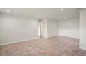 Spacious living room with tile flooring, recessed lighting, and neutral color palette at 4414 Royal Oak Ln, New Port Richey, FL 34653