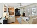 Inviting living room featuring hardwood floors, comfortable seating, and a seamless transition to the kitchen at 4984 Beach Se Dr # B, St Petersburg, FL 33705