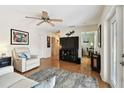 Comfortable living room with hardwood floors, neutral walls, and a view into an adjacent office space at 4984 Beach Se Dr # B, St Petersburg, FL 33705