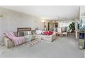 Open-concept living room featuring a spacious layout with plush seating and a dining area at 5200 Brittany S Dr # 1501, St Petersburg, FL 33715