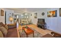Spacious living area with a dining area, complemented by stylish decor and hardwood floors at 5695 40Th N Ave # 301, Kenneth City, FL 33709
