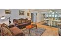 Cozy living room with hardwood floors, elegant furniture, and abundant natural light at 5695 40Th N Ave # 301, Kenneth City, FL 33709