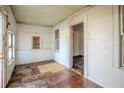 Sunny sun room features tile flooring and windows with a view into the room next door at 1520 S Michigan Ave, Clearwater, FL 33756