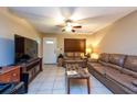 Inviting living area features tile flooring, ample seating, and natural light at 2175 Fox Chase Blvd, Palm Harbor, FL 34683