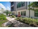Street view of modern townhouses with meticulous landscaping and sidewalks at 2511 N Grady Ave # 43, Tampa, FL 33607