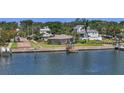Charming waterfront home with private dock, beautiful landscaping, and serene water views, perfect for enjoying coastal living at 2800 Coffee Pot Ne Blvd, St Petersburg, FL 33704