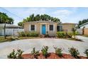 Delightful single-story home with white shutters, manicured landscaping, and a vibrant blue front door at 3115 Bay Ln, Clearwater, FL 33759