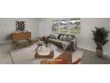 Bright living room features an abundance of natural light, stylish furniture, and open floorplan at 5627 57Th N Ave, St Petersburg, FL 33709