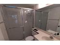 Bathroom featuring a shower with sliding doors and a vanity with a sink and a mirror at 642 Bird Bay E Dr # 205, Venice, FL 34285