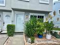 Inviting front entrance features a lovely garden, creating a warm and welcoming atmosphere at 6781 121St Ave # H, Largo, FL 33773