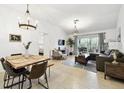 Inviting living room with modern decor, a comfortable sofa, and access to an outdoor patio at 878 Franklin Cir, Palm Harbor, FL 34683