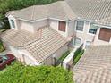 Overhead view of a townhome showcasing the tile roof, private courtyard, and meticulous landscaping at 897 Lantern Way, Clearwater, FL 33765