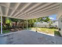 Spacious covered patio area with concrete flooring, perfect for outdoor entertaining or relaxation at 2509 W Crawford St, Tampa, FL 33614
