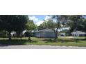 Cozy single-story home with a fenced yard and mature landscaping at 4105 W Tyson Ave, Tampa, FL 33611