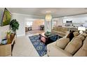 Comfortable living room flows into a dining area and modern kitchen, perfect for entertaining at 4505 S Clark Ave, Tampa, FL 33611