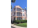Three-story condo building with screened patios on each level at 5000 Culbreath Key Way # 1-220, Tampa, FL 33611